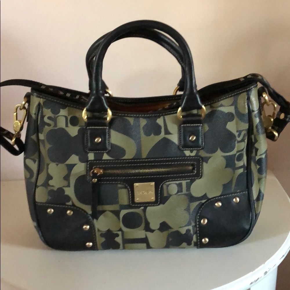 Pre-owned tous bag with long strap.